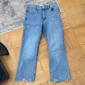 Stylish cropped jeans with frayed bottoms